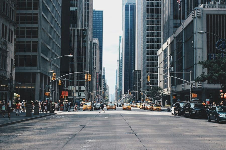 City avenue lined with glass high-rises