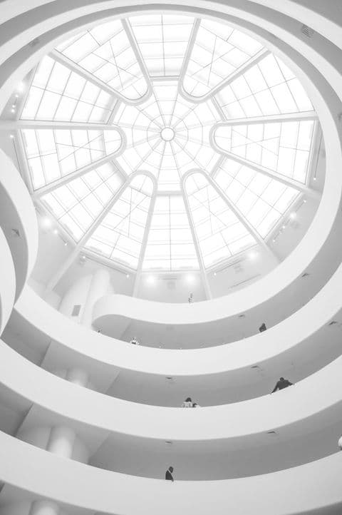 White domed skylight flooding an atrium with daylight