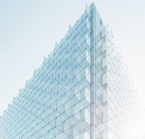 Blue patterned glass panels on a high-rise facade